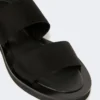 Flat sandals in leather and elasticated webbing, black Flat sandals in leather and elasticated webbing, black