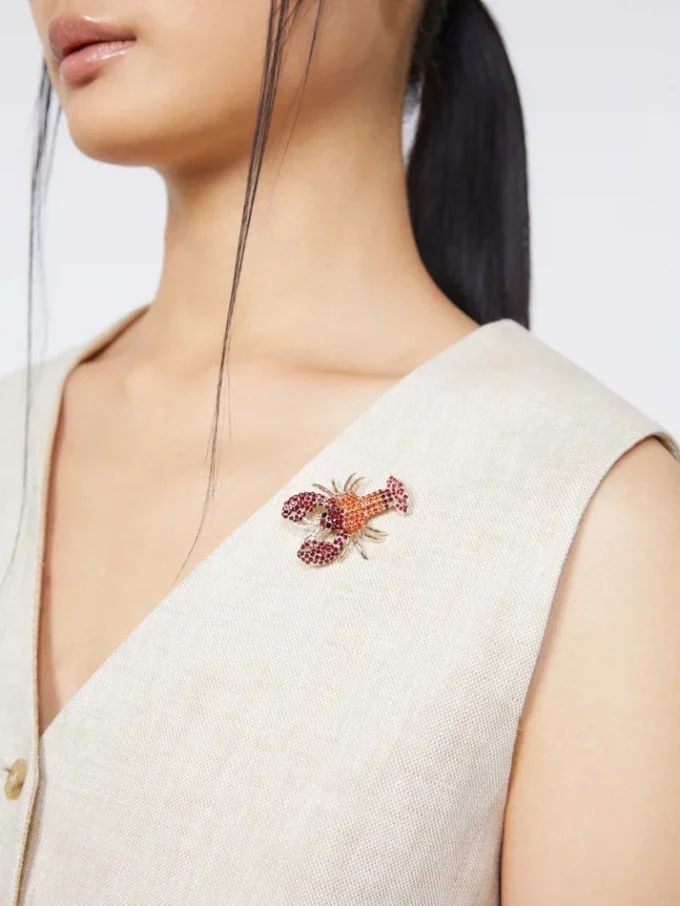 Metal brooch with rhinestones, dark red