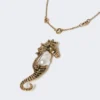 Metallic necklace with pin pendant, gold