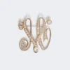Monogram brooch with rhinestones, ivory