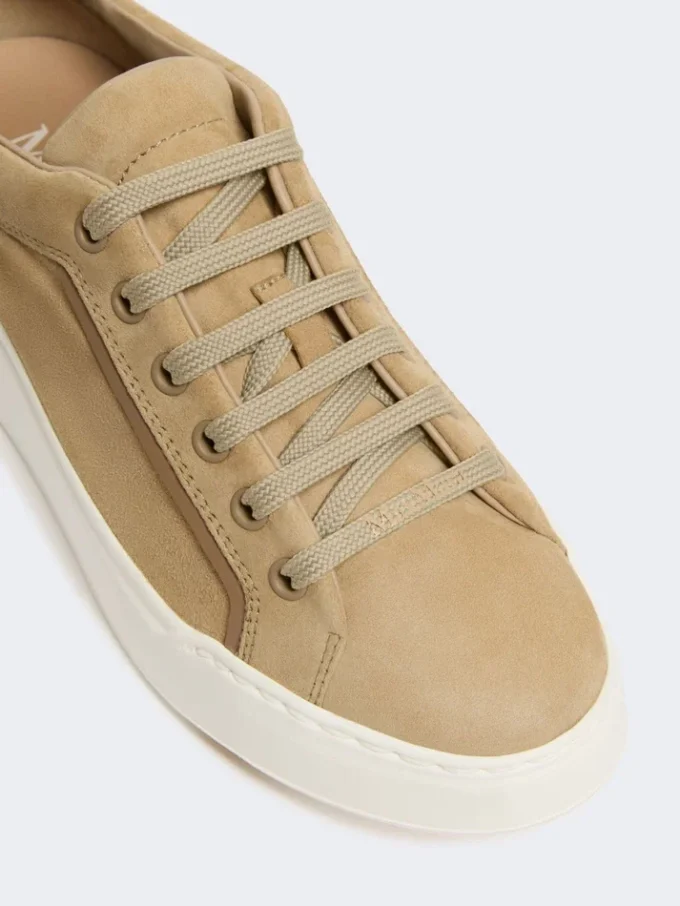 Suede sneakers, sand