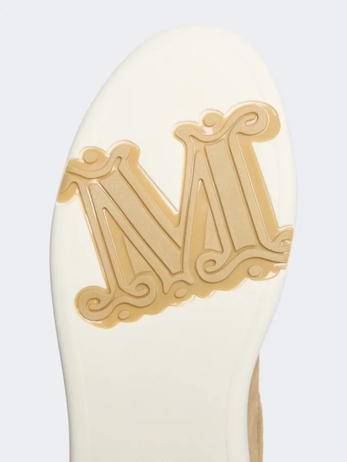 Suede sneakers, sand